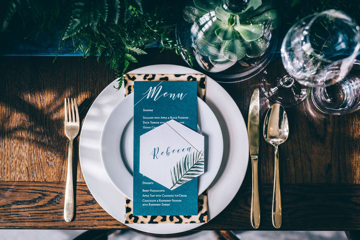 70's style, 2017, art deco, bold, bouquet, Bow, brass, bridal jumpsuit, bride, Brigitte Fisher, bronze, candles, Credition, deco, Devon Wedding Photographer, dress, Edible Essence Couture Cake Co, Emmy Shoes, ferns, foliage, Genevieve Satha Make-up, glamour, graphic, Inspire Hire, jumpsuit, jungle luxe, Knots & Kisses, Kye Tew Jewellery, leopard print, Maxi Photography, model, modern, name setting, Paschoe House, Paschoe House wedding photographer, peacock chair, place setting, Rock The Frock, Sarah-Jane Mackfall, stationery, styled shoot, styling, succulents, table plan, teal, uber-glam, virginias vintage hire, wedding dress, wedding jumpsuit, Winsor Flower Studio